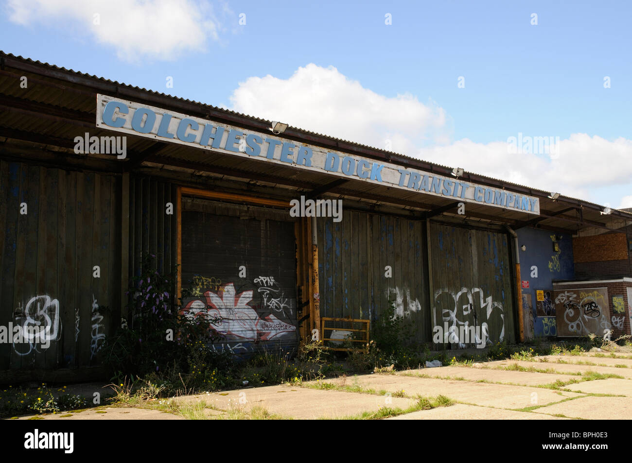 The old Colchester Dock Transit Company premises now derelict on the River Colne at Hythe Colchester Essex England UK Stock Photo