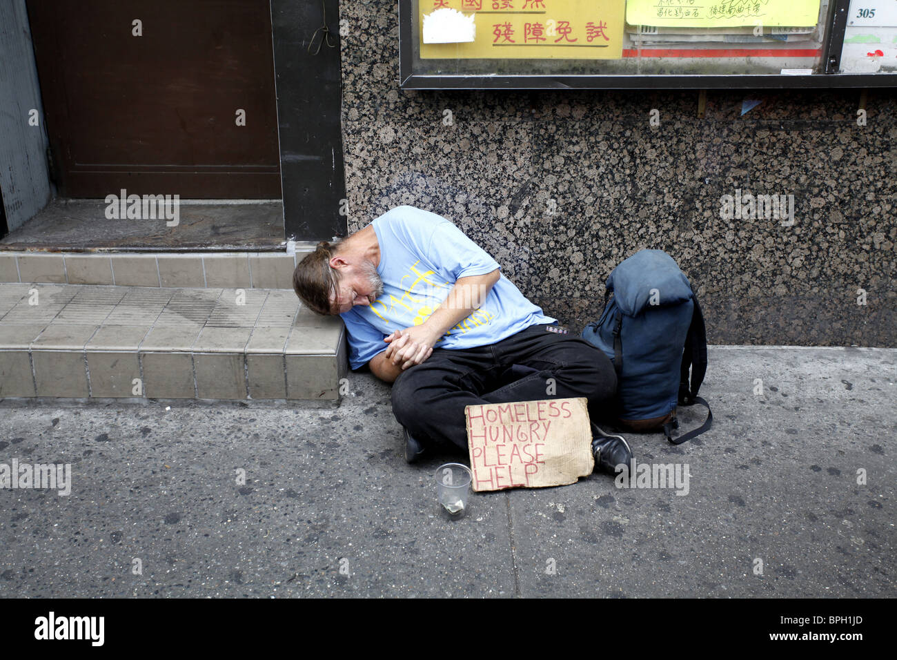 Homeless man asleep in Chinatown. New York Stock Photo - Alamy