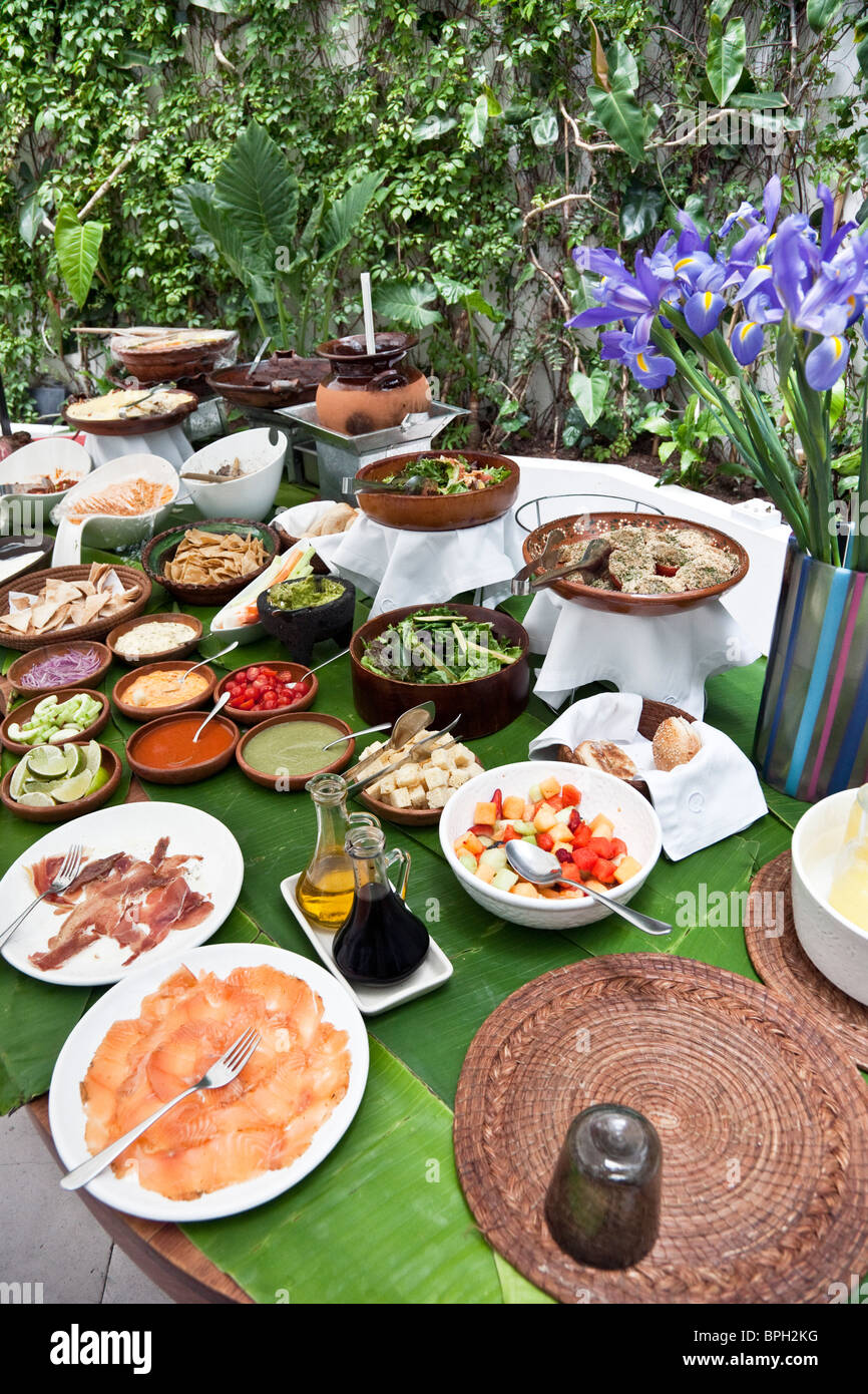 Buffet Table With Smoked Salmon Prosciutto Fruits Chips Dips In