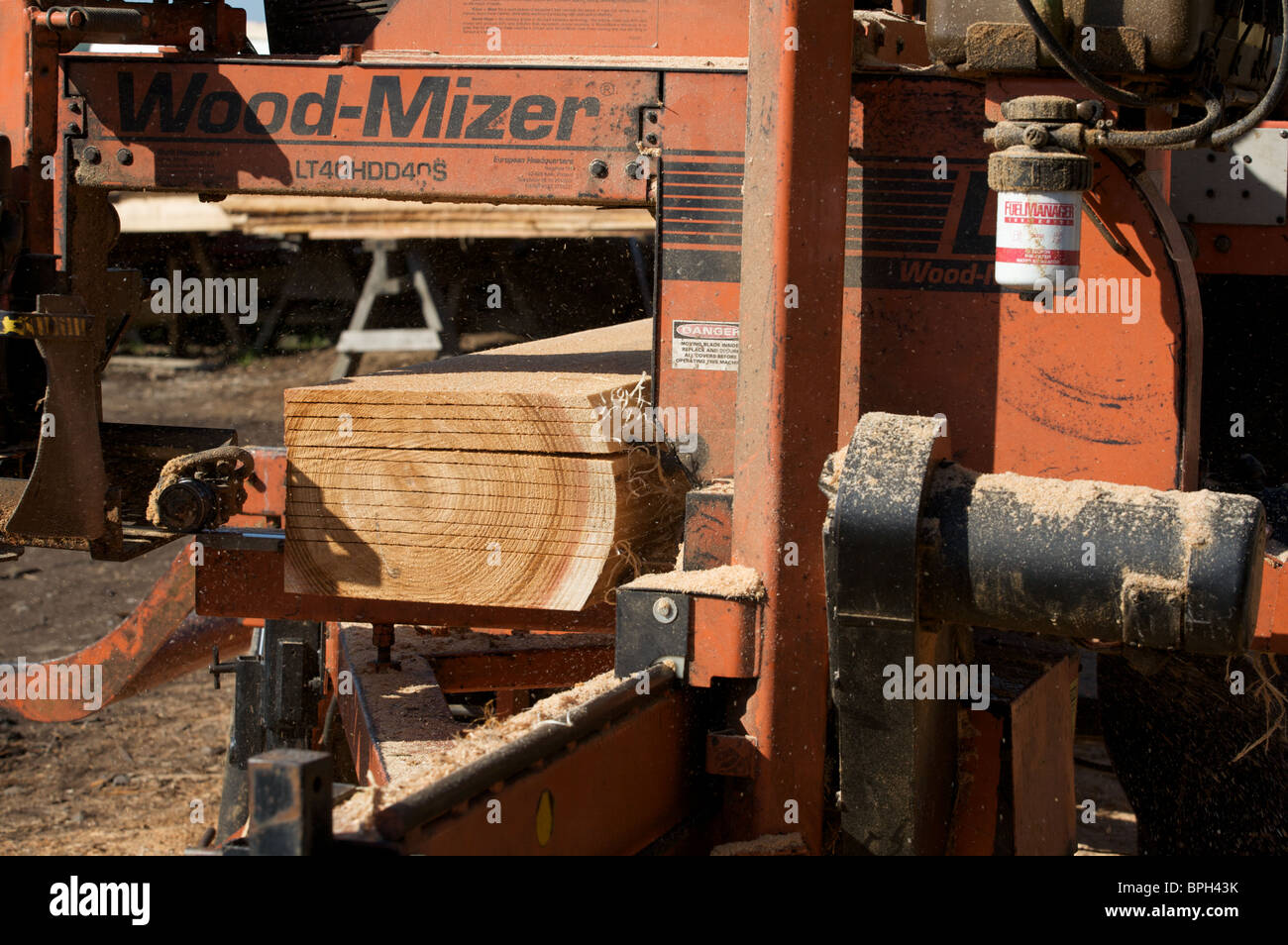 Wood being made into planks Stock Photo Alamy