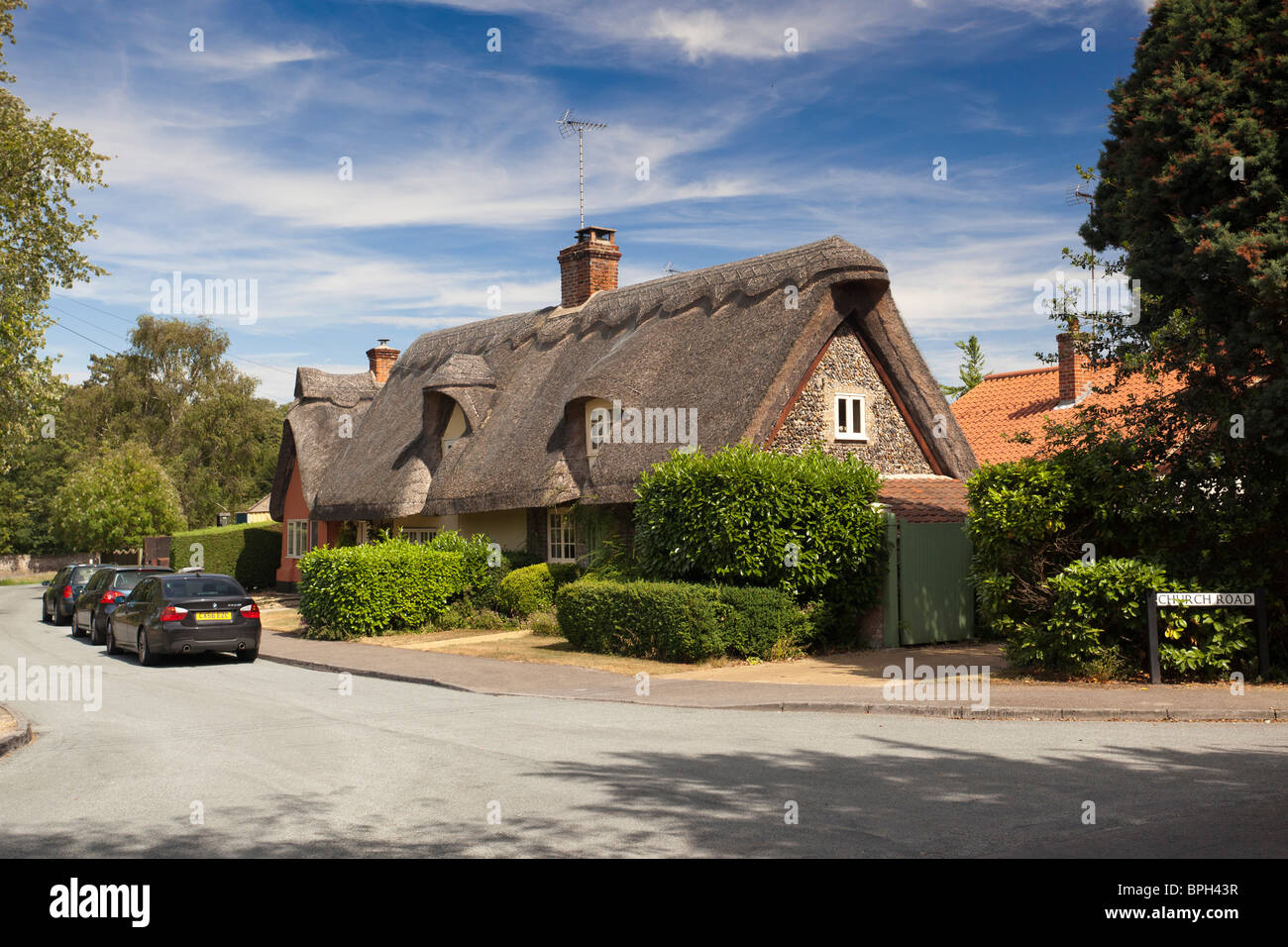 thatched roof cottage at Moulton village in Suffolk, UK Stock Photo
