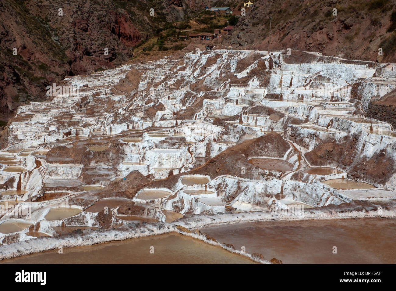 Salt pans dry out in the sun in the high Andes, at Salinas, in the Urubamba area of the Sacred Valley, Peru. Stock Photo