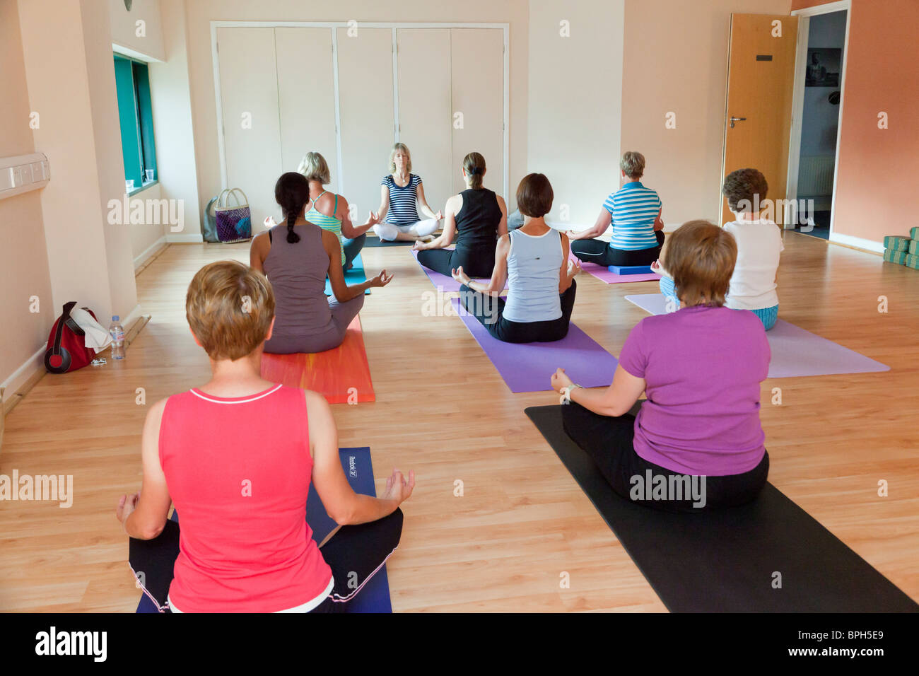 women in a meditation / yoga class Stock Photo