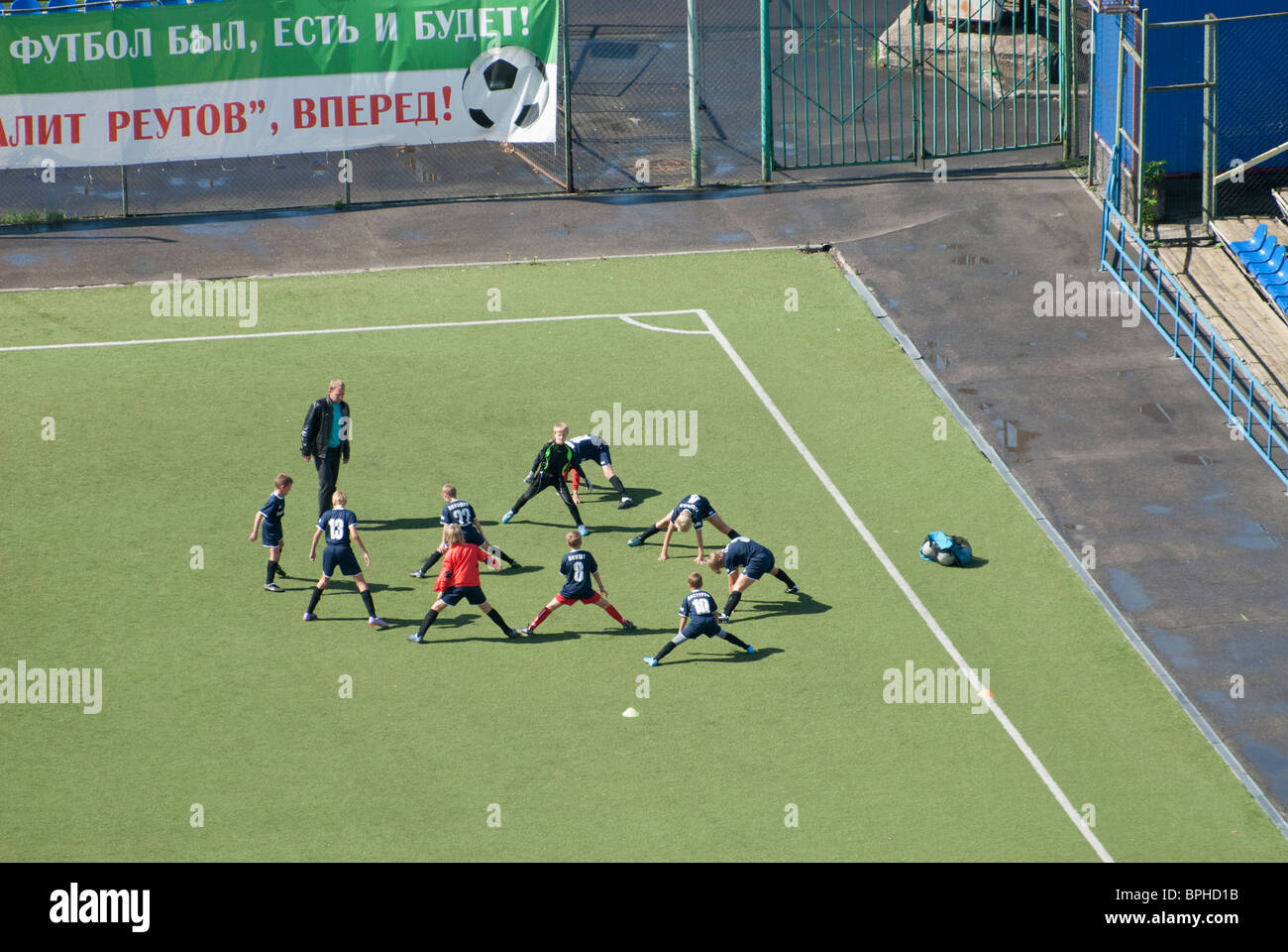 Training of Russian kids football team before a match Stock Photo