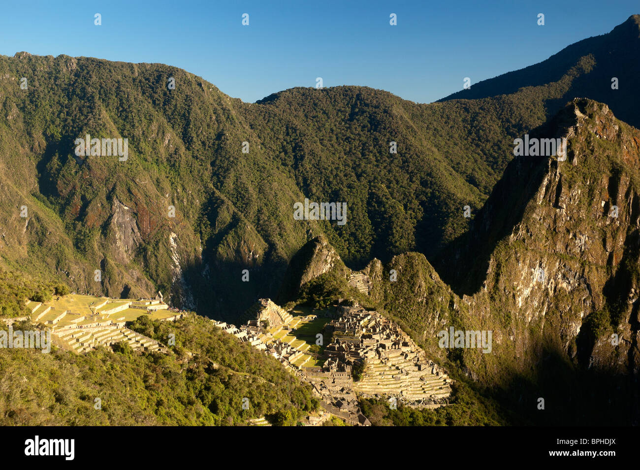 The first view of Machu Picchu that Inca Trail hikers see, from the Sun Gate, Sacred Valley, Peru. Stock Photo