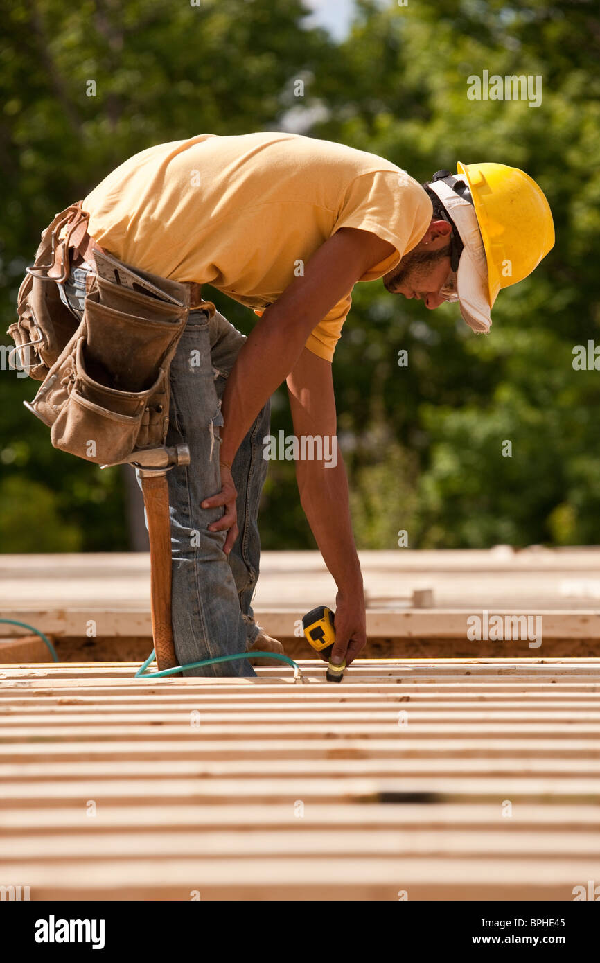 Carpenter measuring wood Stock Photo
