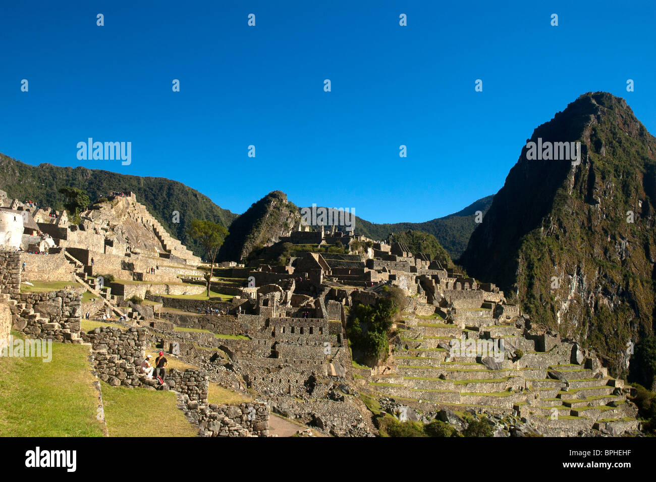 Intricate stonework of ruined buildings and garden terraces at the ancient Incan city of Machu Picchu, Peru. Stock Photo