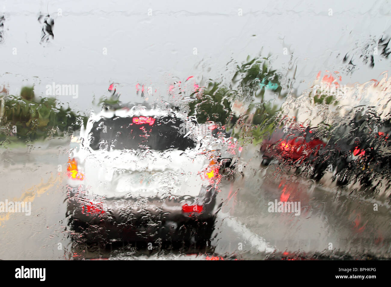 Rainy road through the windshield Stock Photo