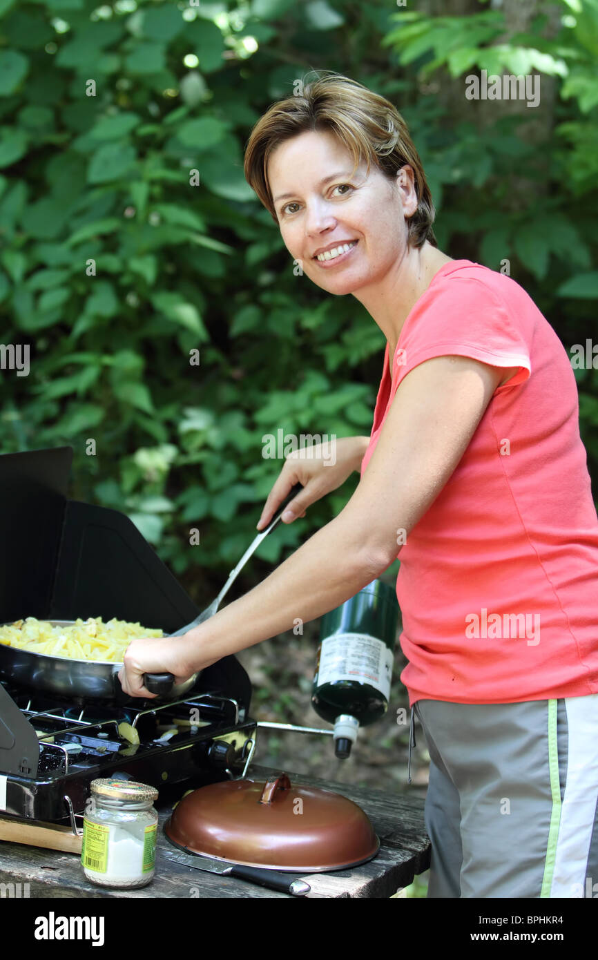 Cooking breakfast or lunch outdoor in camping Stock Photo