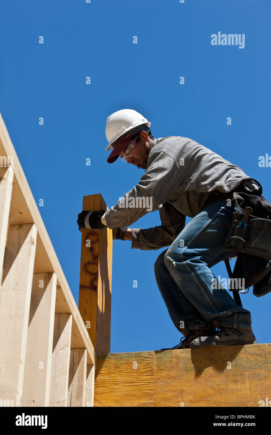 Carpenter lifting a beam Stock Photo Alamy