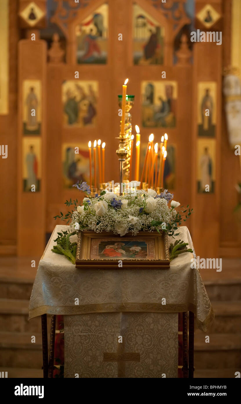 An icon and candles in the Russian Orthodox Church London England Stock Photo