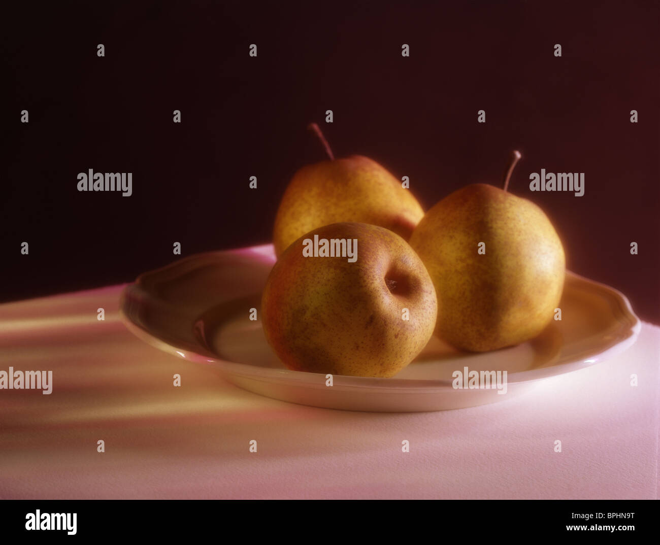 3 pears on a plate, painterly Stock Photo