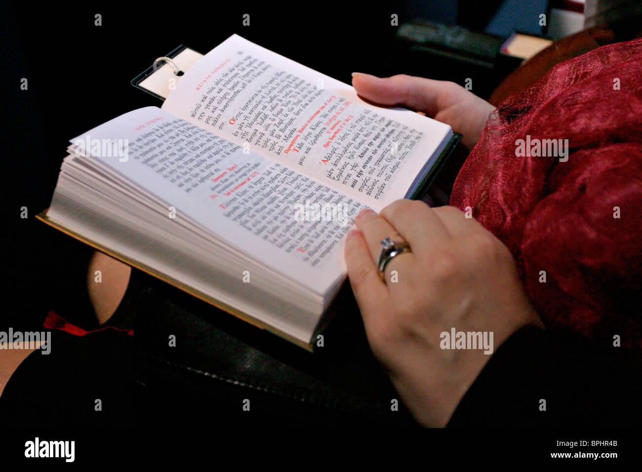 Hands Holding A Greek Orthodox Bible Stock Photo Alamy