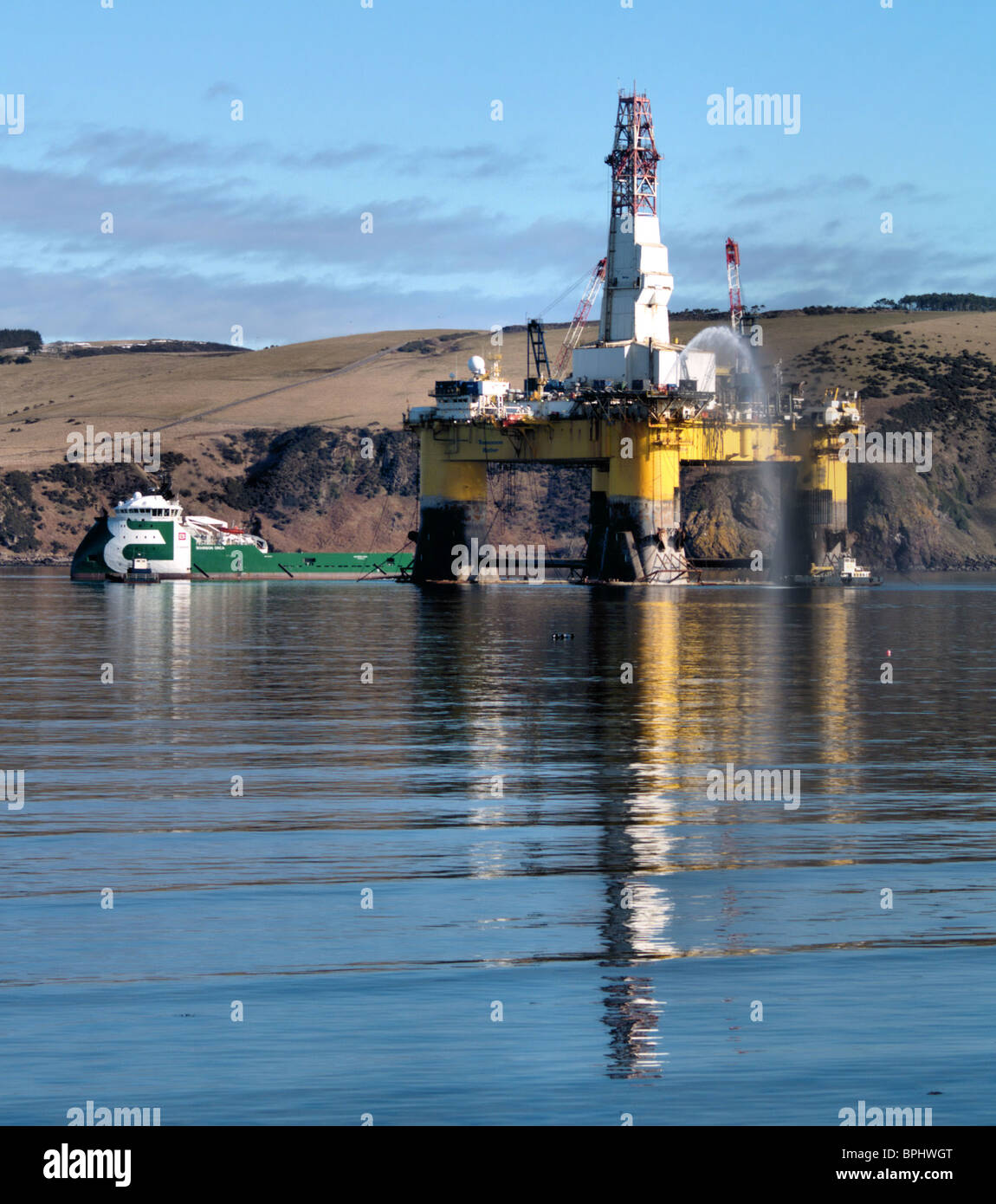 The oil rig tug 'Orca' with her revolutionary X bow, lifts anchors on the Semi-submersible Oil Rig the 'Transocean Rather' Stock Photo