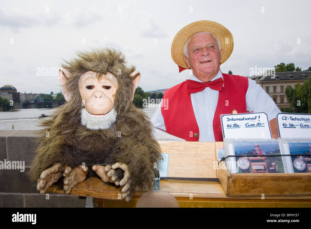 Barrel Organ man with his monkey on the Charles Bridge in Prague, Czech Republic Stock Photo