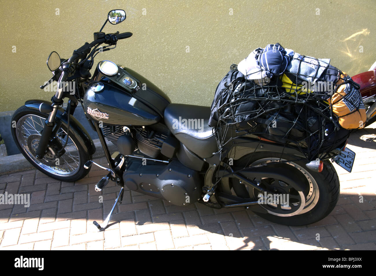 Harley Davidson motorbike packed with luggage for traveling Stock Photo