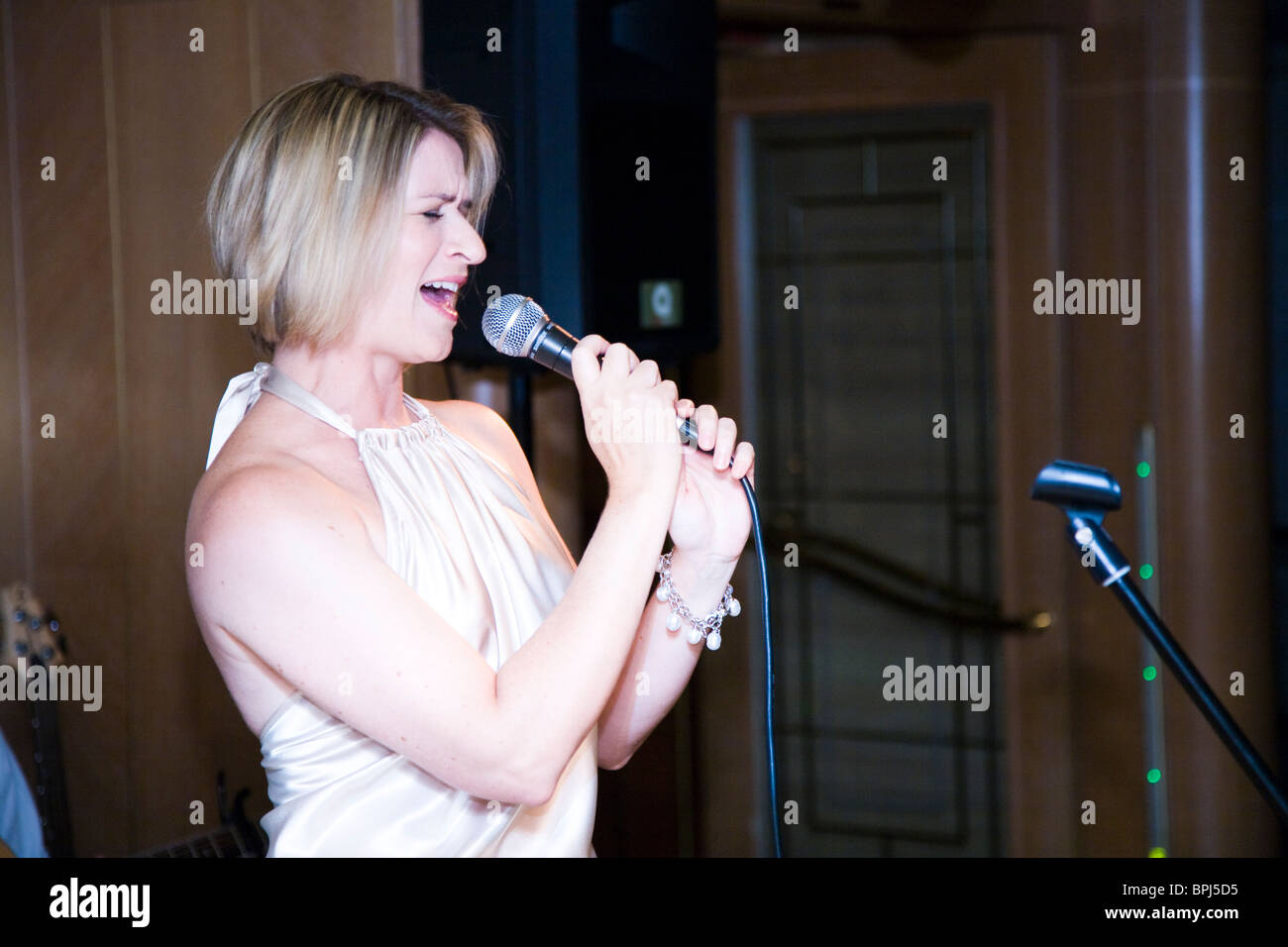 Helga Lucas performs in French during the crew show Orion Kimberley Highlights cruise Western Australia Stock Photo