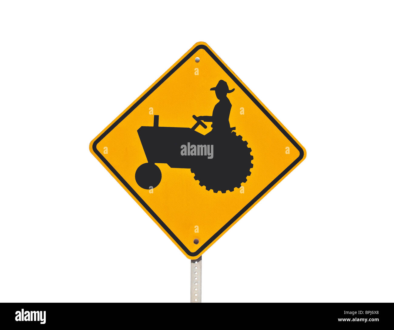 Farm tractor crossing caution sign isolated on white. Stock Photo