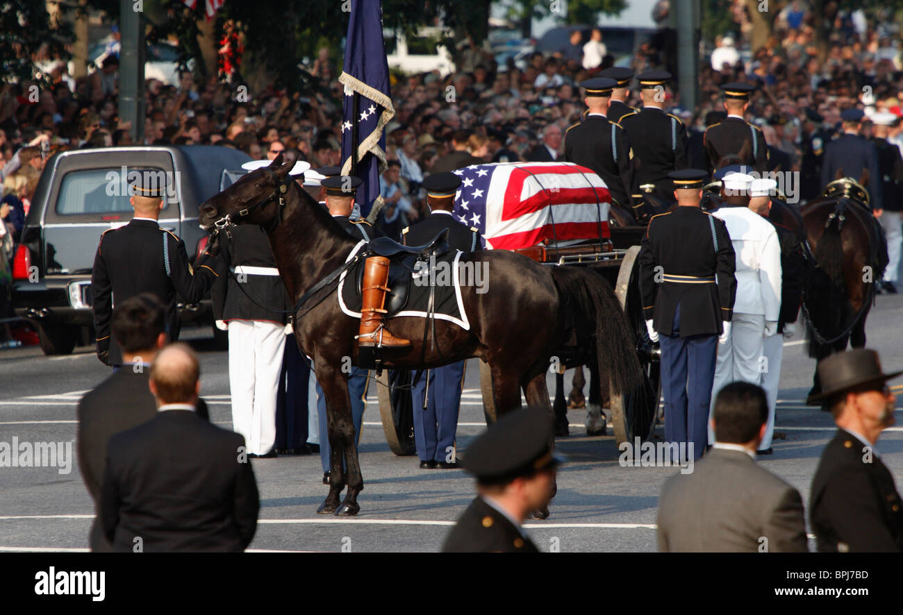 The caisson with the casket of former US President Ronald Reagan and a riderless horse with his boot during funeral procession. Stock Photo