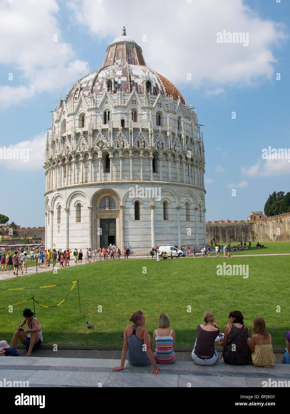 the Baptistry on Piazza dei Miracoli with many tourists Pisa Tuscany Italy Stock Photo