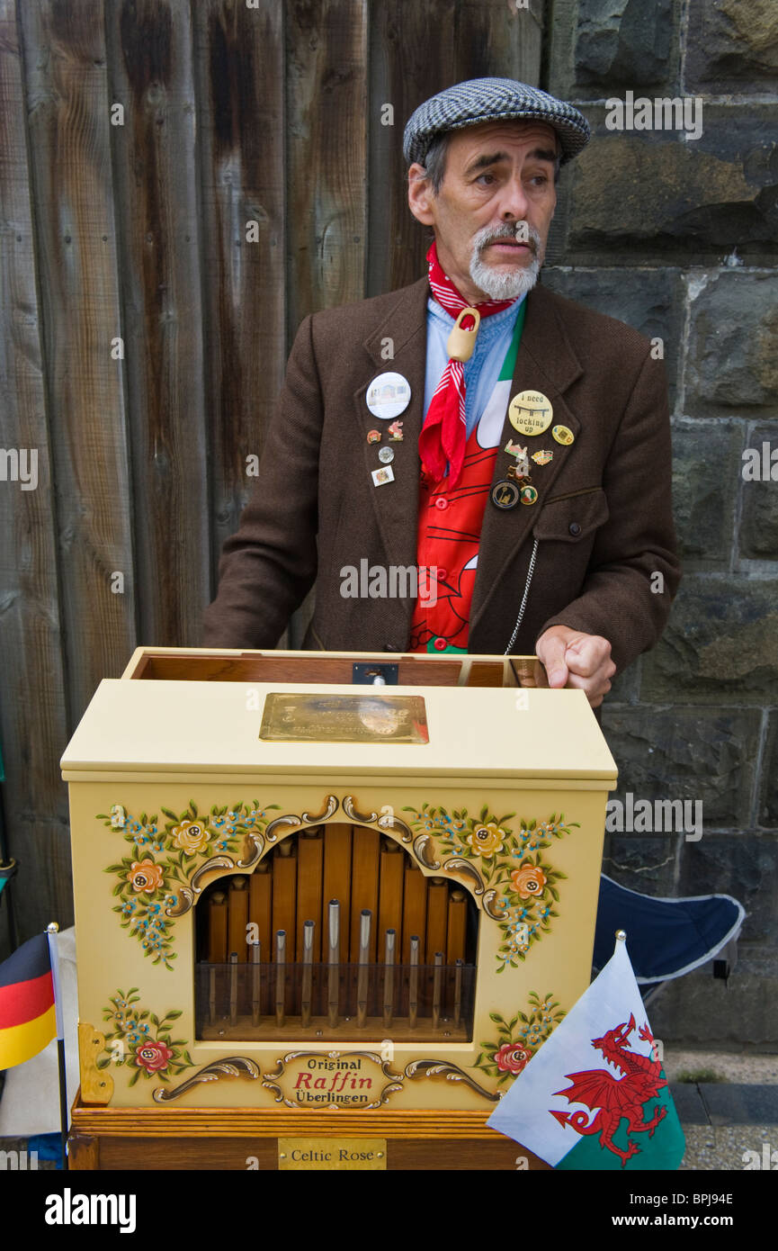 Organ grinders in period costume playing street organs at the Victorian