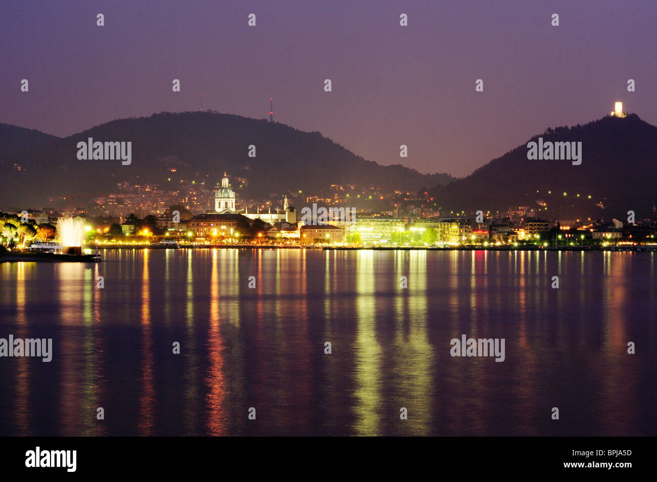 View over Lake Como to Como at night, Lombardy, Italy Stock Photo