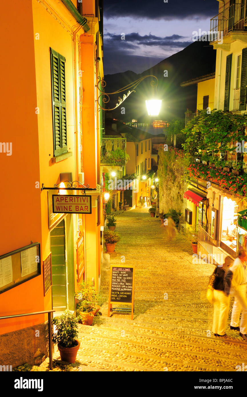 Illuminated alley with restaurants, Bellagio, Lake Como, Lombardy, Italy Stock Photo
