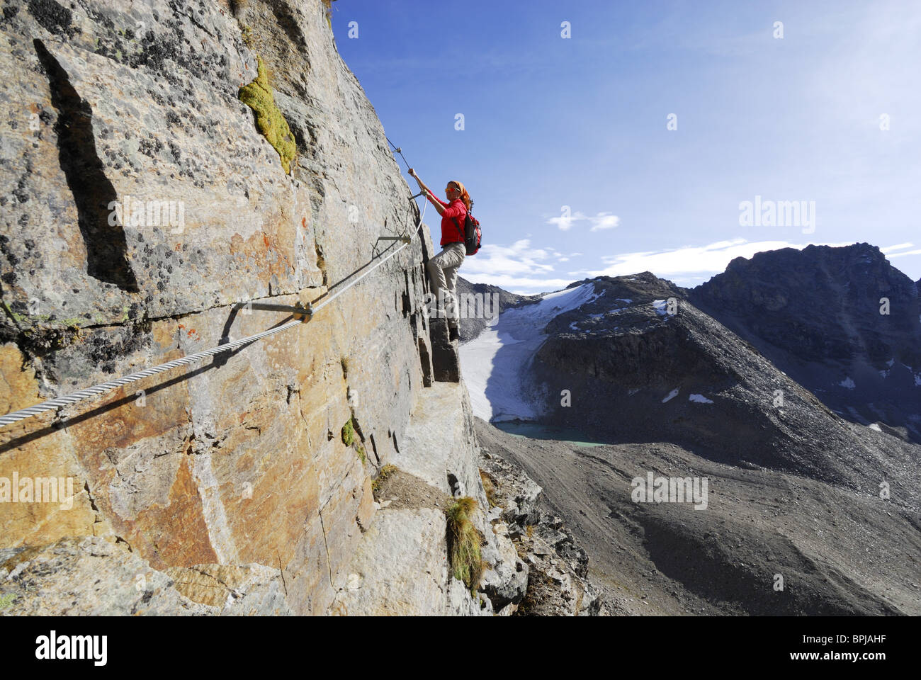 Woman climbing fixed rope route through Tschenglser Hochwand, Ortler Stock  Photo - Alamy