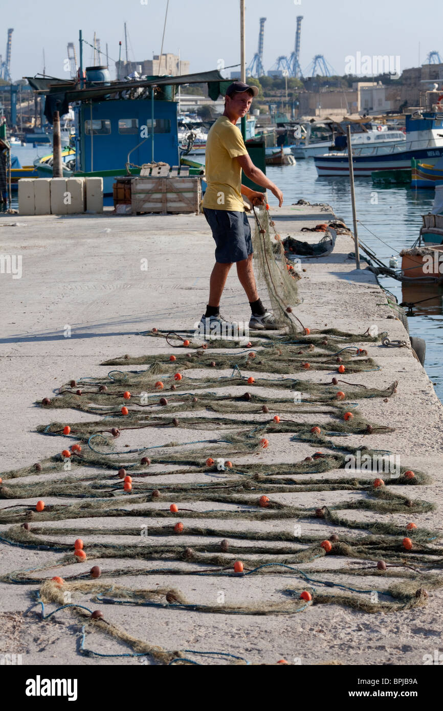 Fisherman Laying Out His Nets At Marsaxlokk Malta Stock Photo Alamy Fisherman Laying Out His Nets At Marsaxlokk Malta Stock Photo Alamy