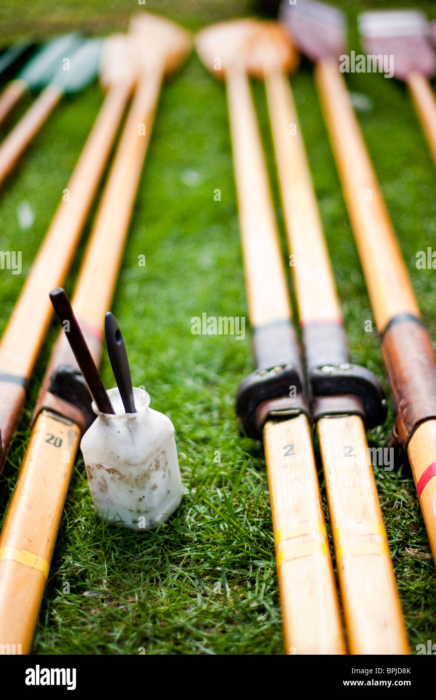 Pairs of oars used for rowing boats,laid out ready to be revarnished Stock Photo