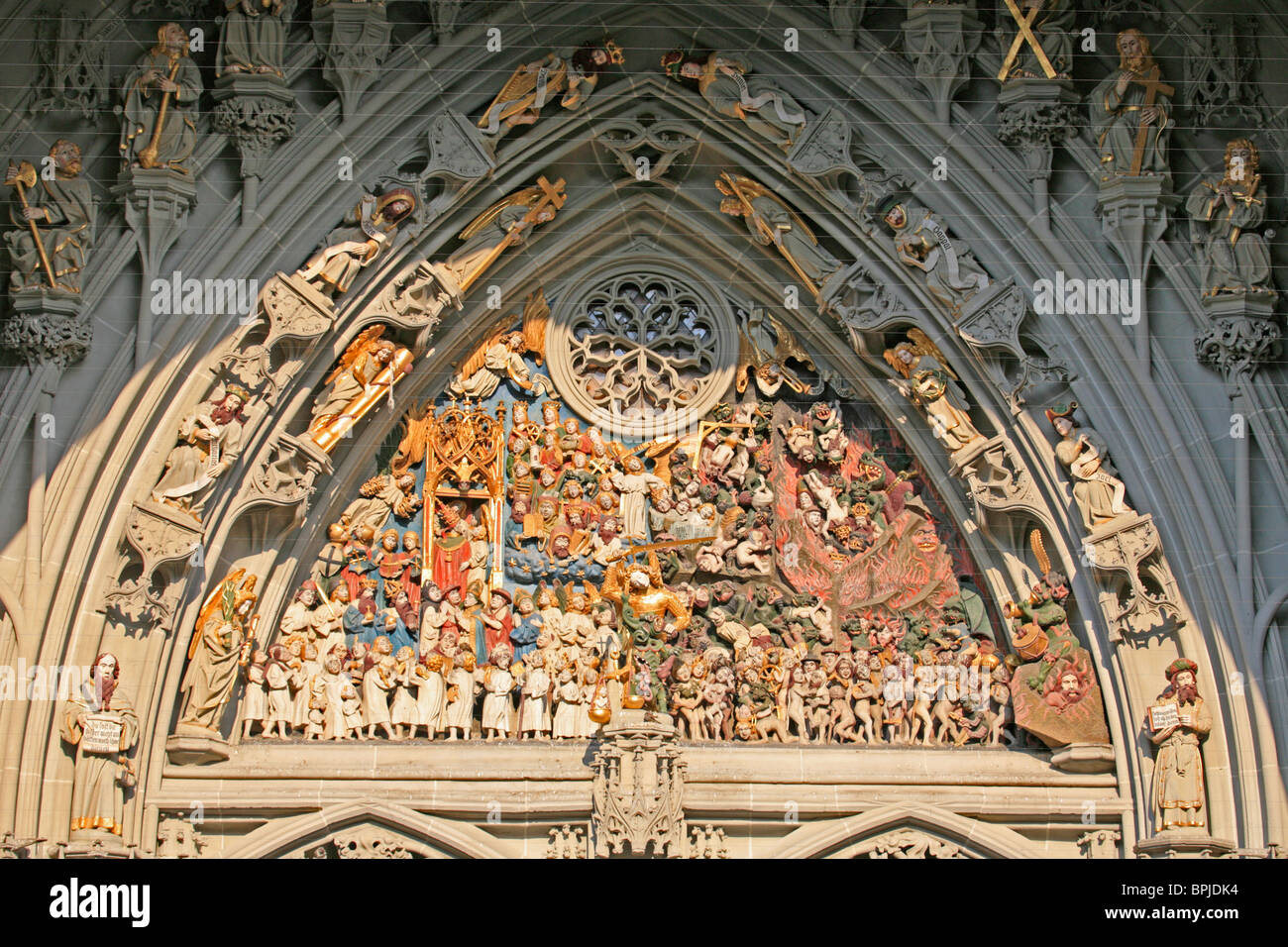 The carved Tympanum above the west door of Bern Cathedral Church. Stock Photo