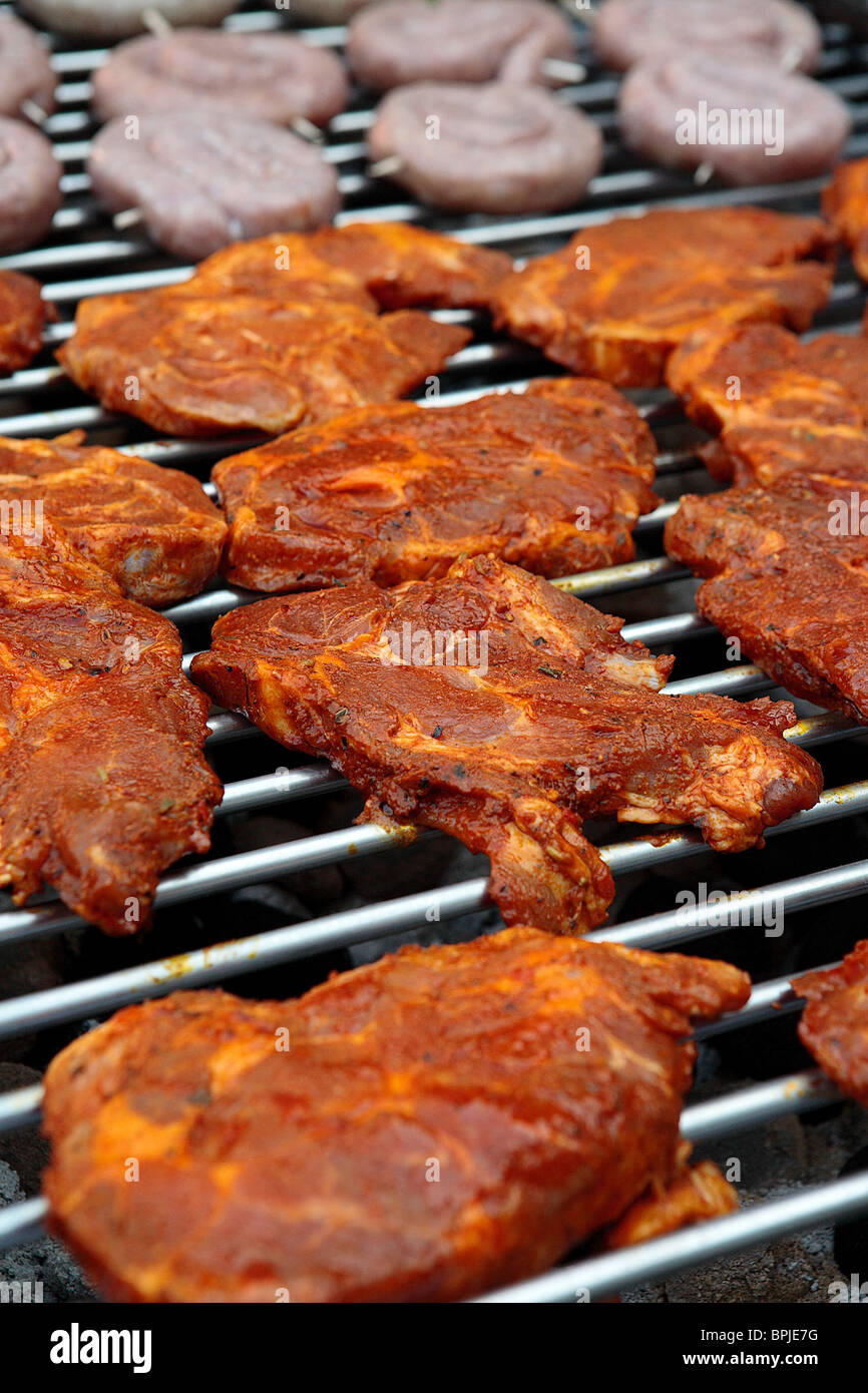 detail german barbecue with marinaded schnitzel and bratwurst/sausage