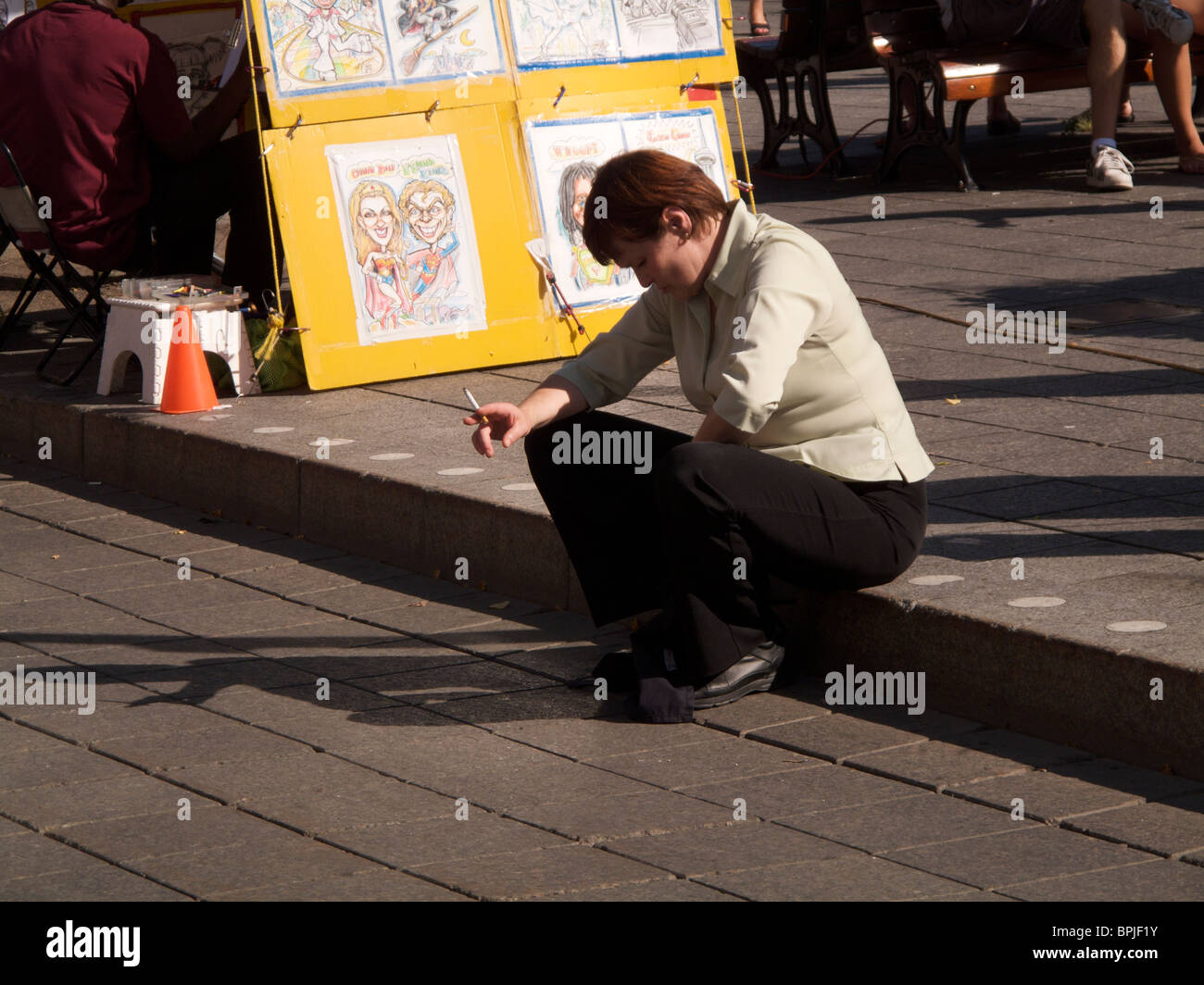Woman smoking a cigarette. Montreal Canada. Stock Photo