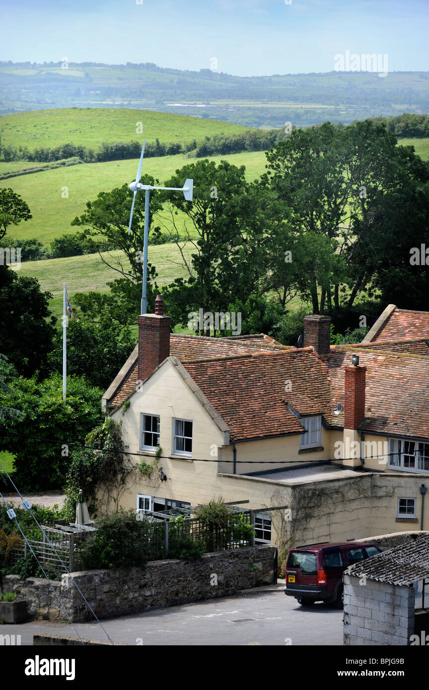 A wind turbine in the garden of a family home in Buckinghamshire UK Stock Photo