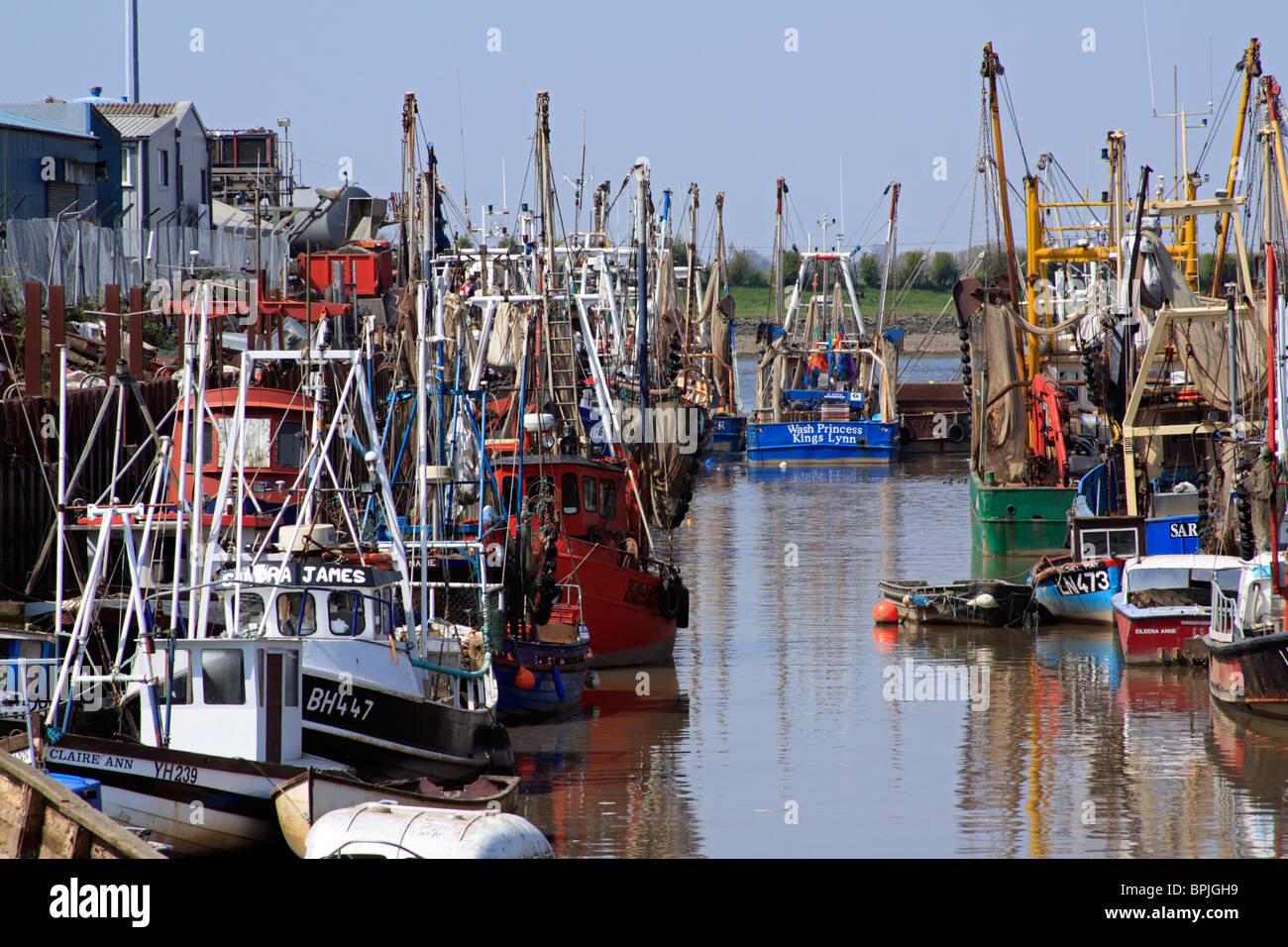 Fishing boats at their berth in a muddy creek off the Great River Ouse