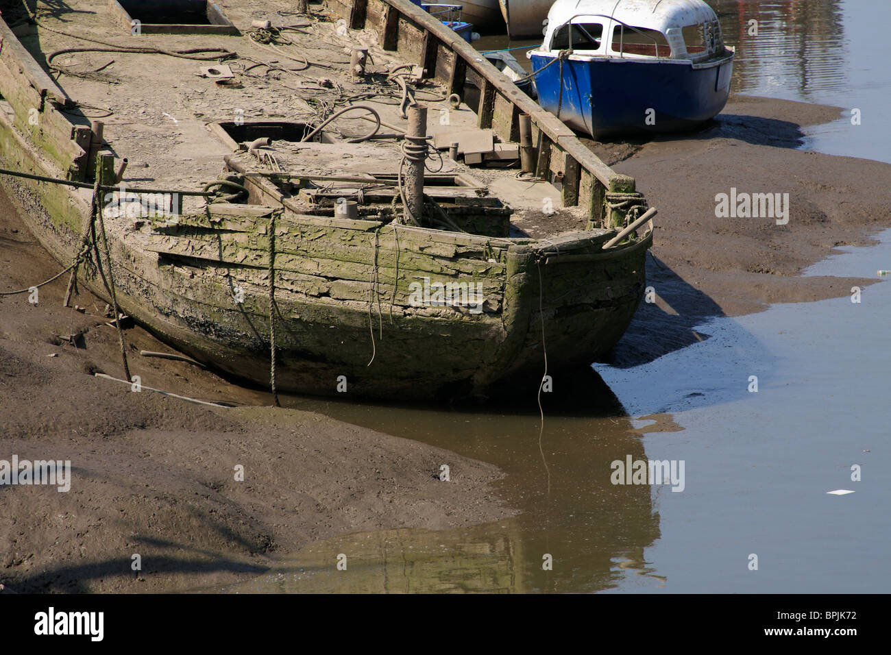 An old rotting barge in a mud berth Stock Photo