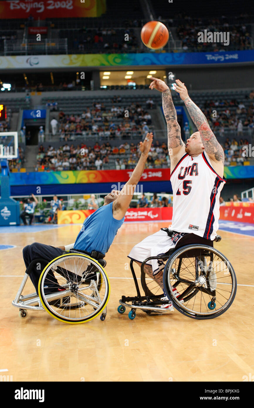 Action in men's wheelchair basketball with the United States (white) vs