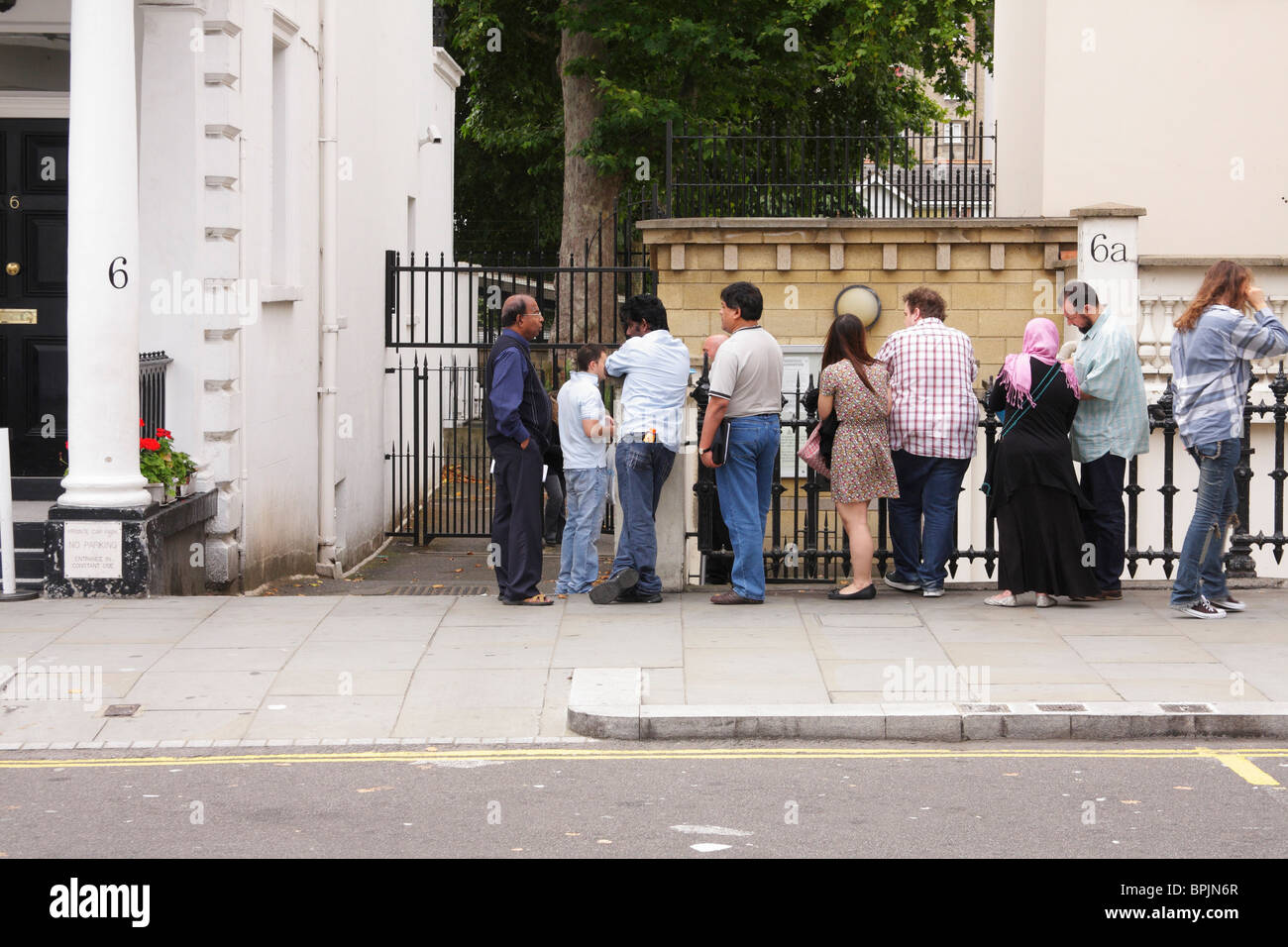 Queue of people waiting in line Stock Photo Alamy