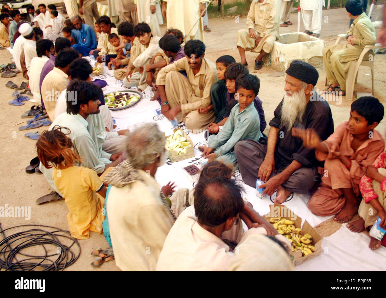 Renowned Social Worker Abdul Sattar Edhi sits along with Flood affected ...