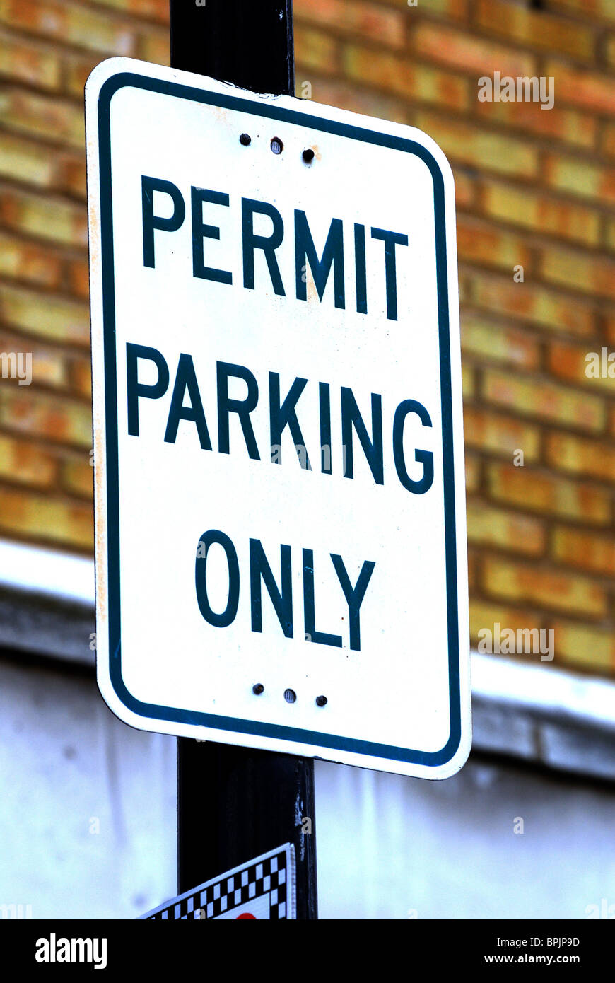 'Permit Parking Only' sign on post Stock Photo