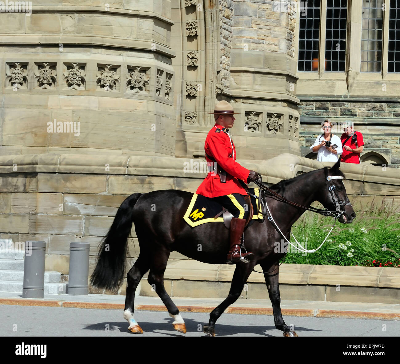 Mountie On Parliament Hill Ottawa Canada To Meet Tourists And Visitors To The Canadain Parliament Buildings Stock Photo