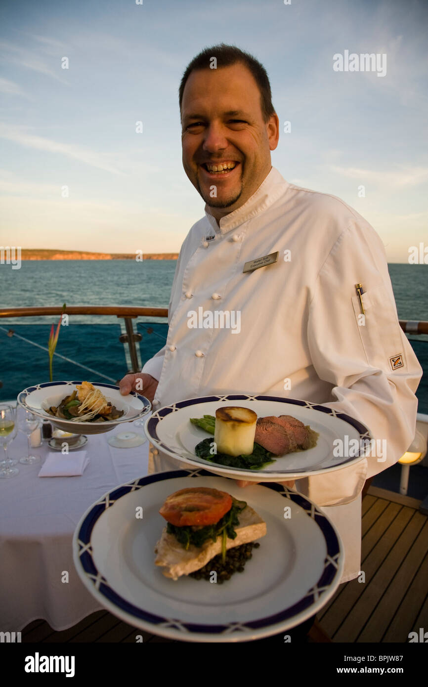 Chef Walter Butti displays dishes from an Orion Degustation Menu during a Kimberley Highlights cruise Western Australia Stock Photo