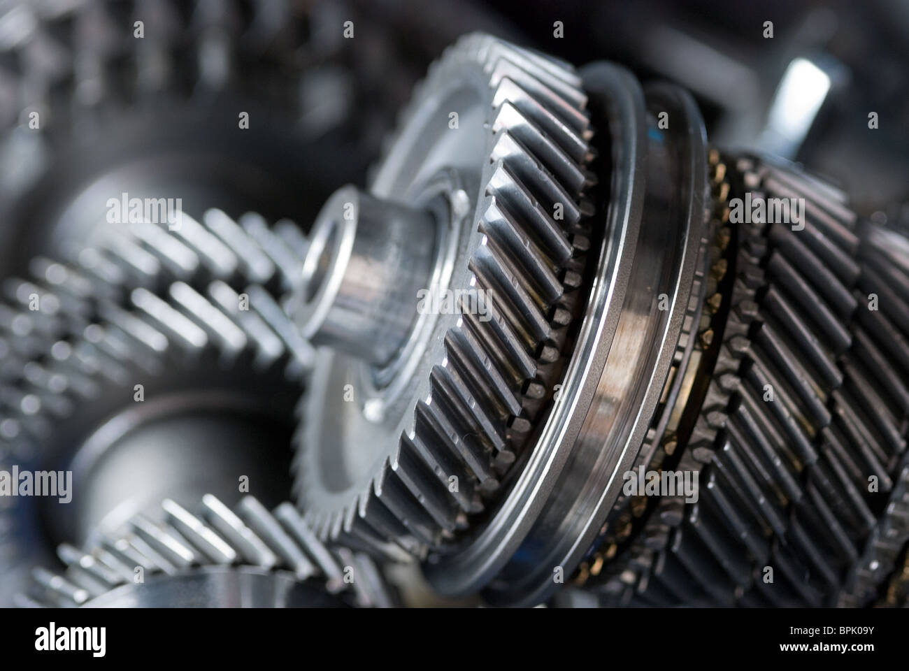 Parts from a vehicle gearbox. Shallow depth of field with the nearest gear in focus. Stock Photo