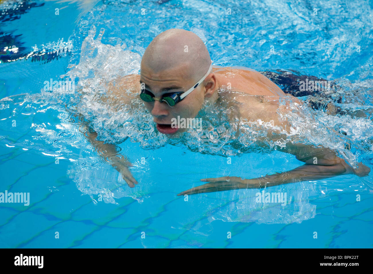 Russia's Alexy Fomenkov in the semi-final of the SB6 men's 100-meter breaststroke event at the Paralympic Games in Beijing. Stock Photo