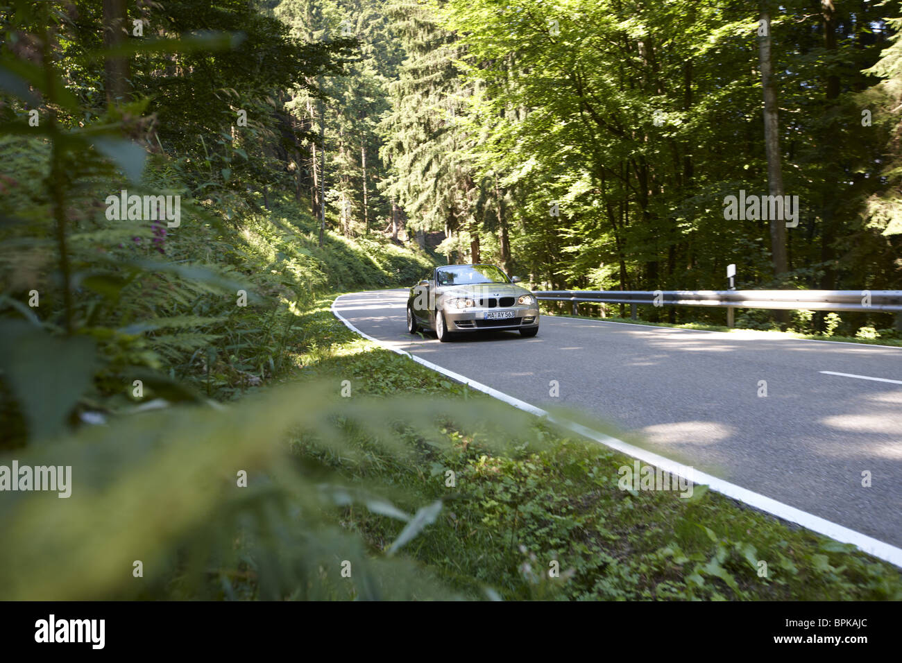 Convertible on a street in the northern Black Forest, Baden-Wuerttemberg, Germany Stock Photo