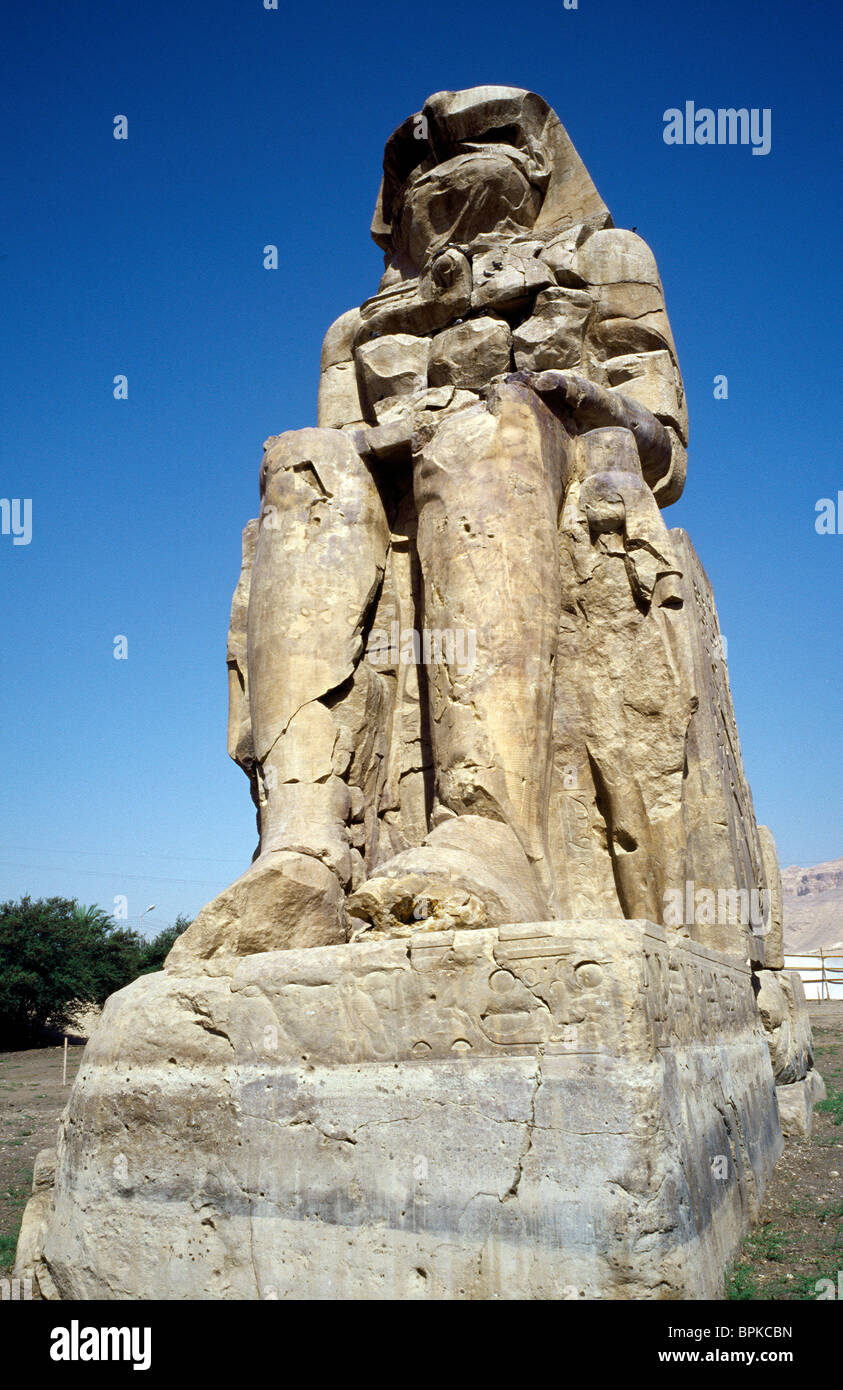One of the two Colossi of Memnon at the Theban Necropolis of Luxor in Upper Egypt. Stock Photo
