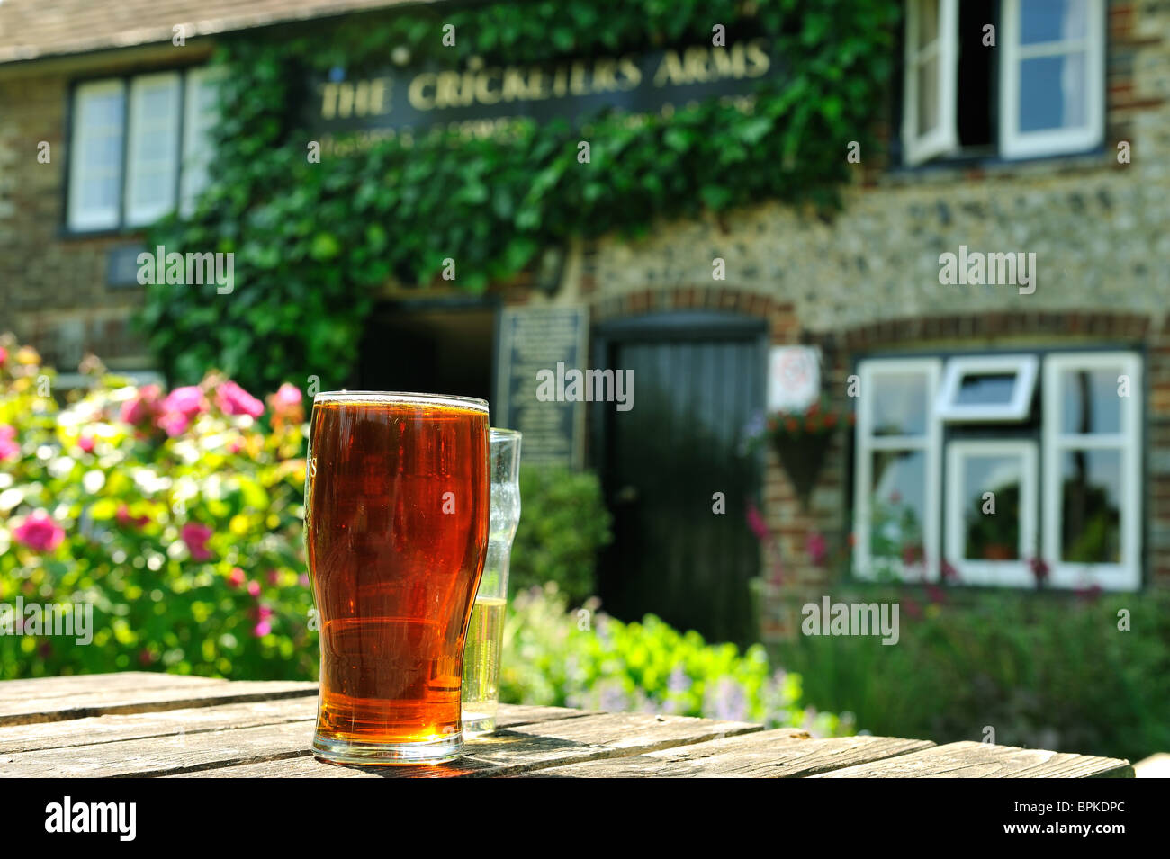 Pint of Beer in an English pub garden of the Cricketers Arms East Sussex Stock Photo