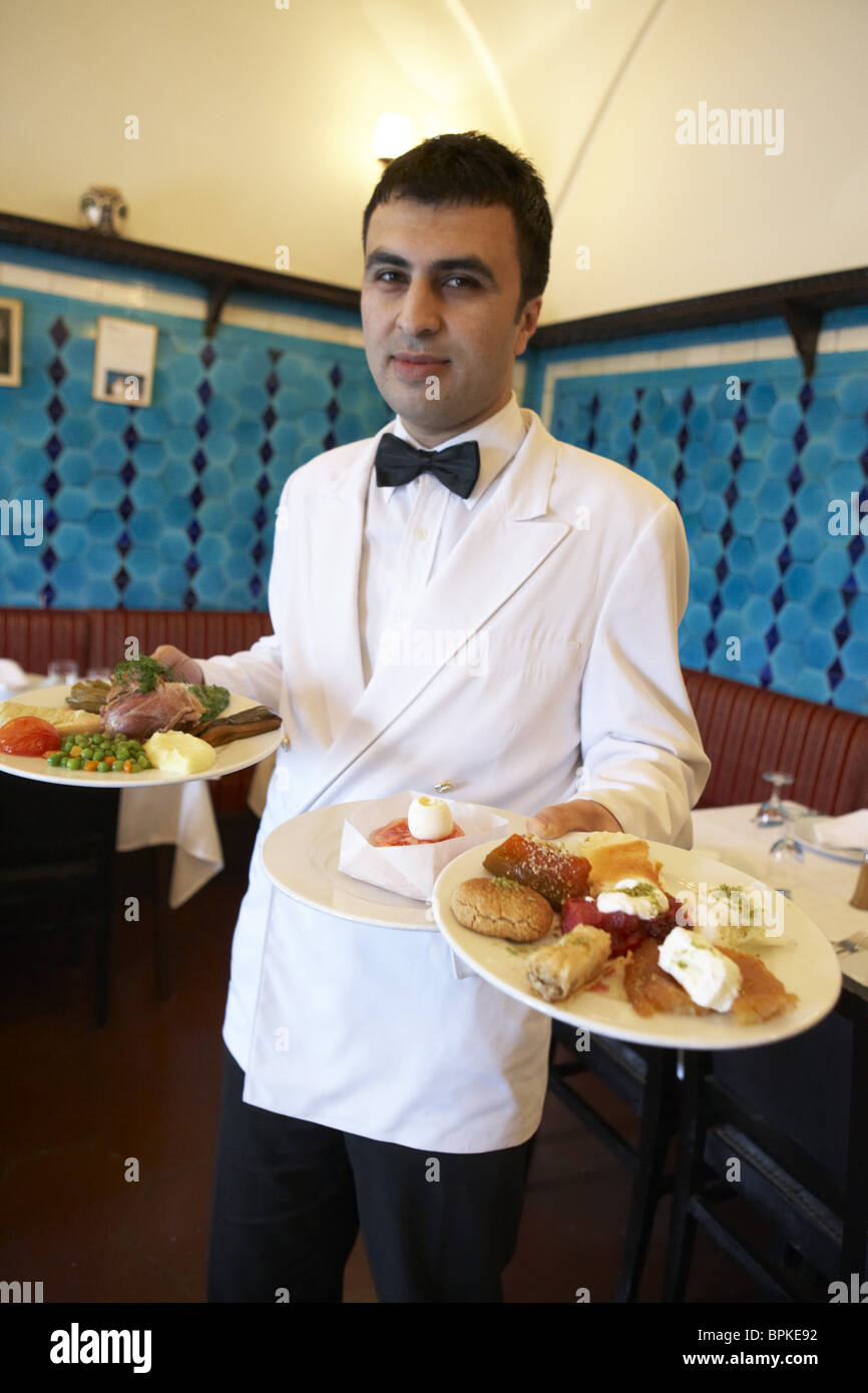 https://c8.alamy.com/comp/BPKE92/waiter-carrying-two-plates-of-food-restaurant-pandeli-istanbul-turkey-BPKE92.jpg