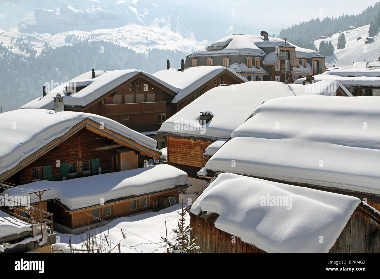 The snow capped roofs of the chalets in the Swiss Alpine town of Murren, Berne Canton, Switzerland. The Bernese Alps. Stock Photo