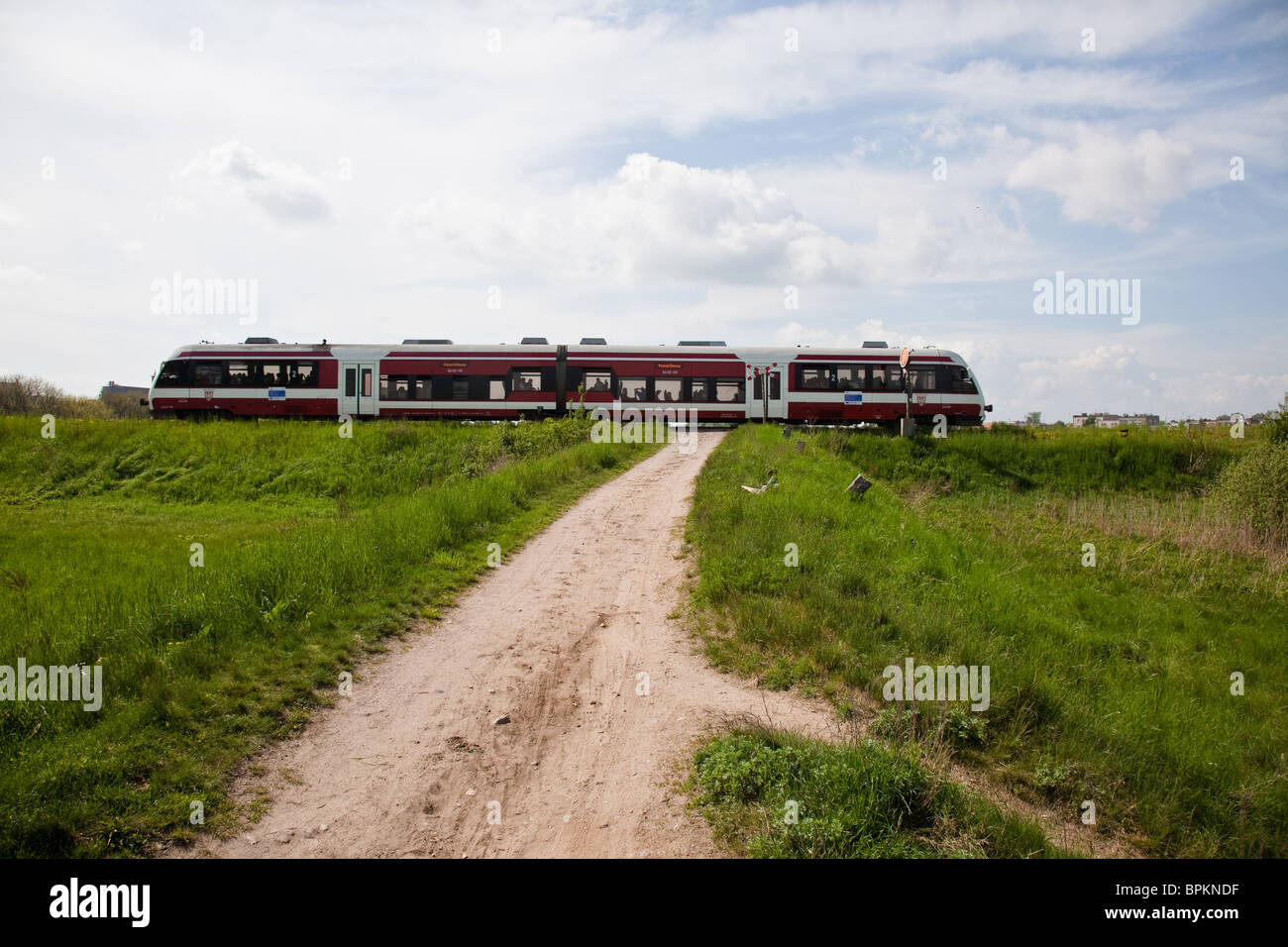 A train is a connected series of vehicles for rail transport that move along a track (permanent way) to transport Stock Photo
